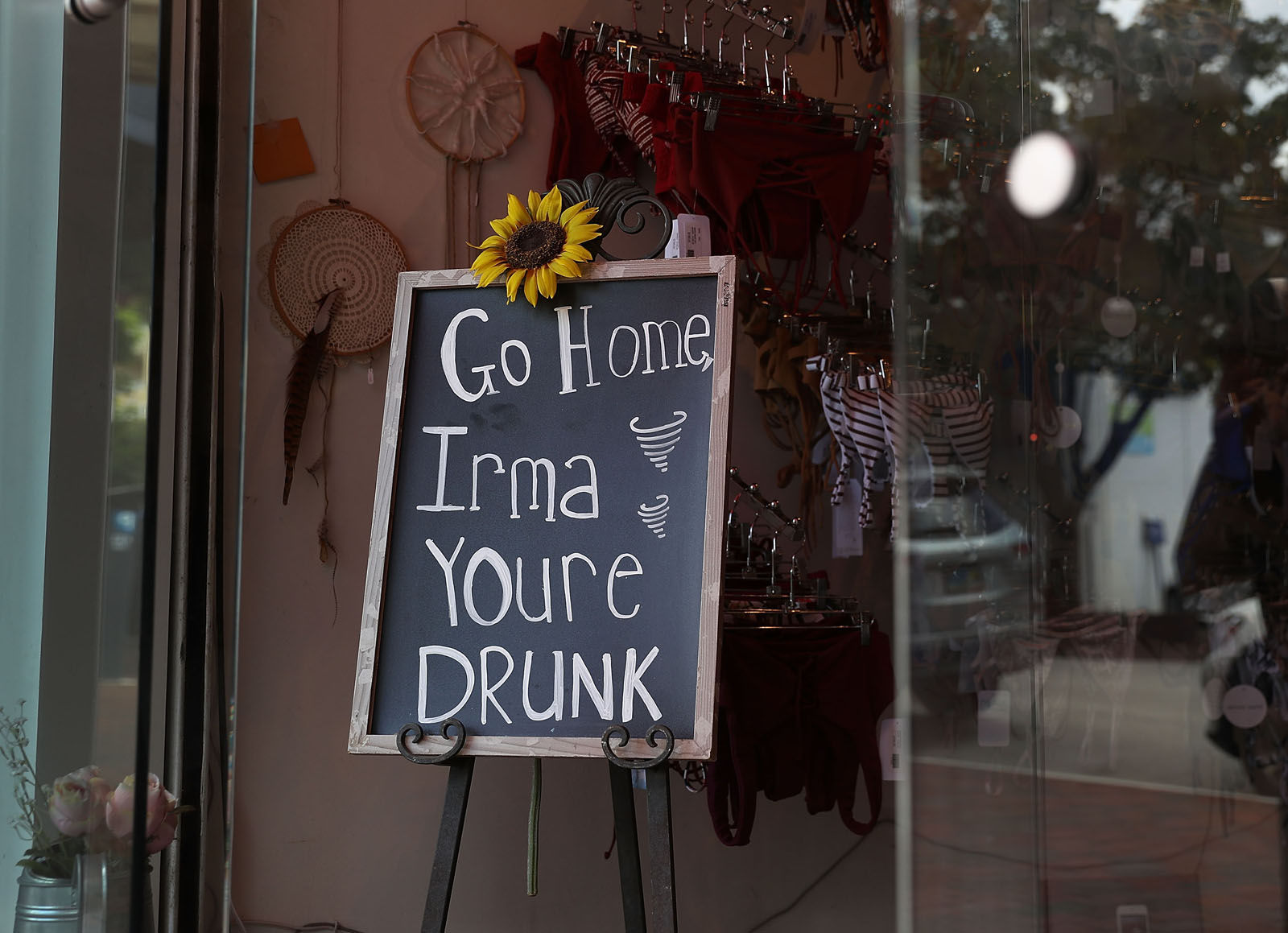 A sign in a business reads, 'Go Home Irma Youre Drunk,' as people prepare for the arrival of Hurricane Irma on Sept. 6, 2017 in Miami, Florida. It's still too early to know where the direct impact of the hurricane will take place but the state of Florida is in the area of possible landfall.  (Photo by Joe Raedle/Getty Images)