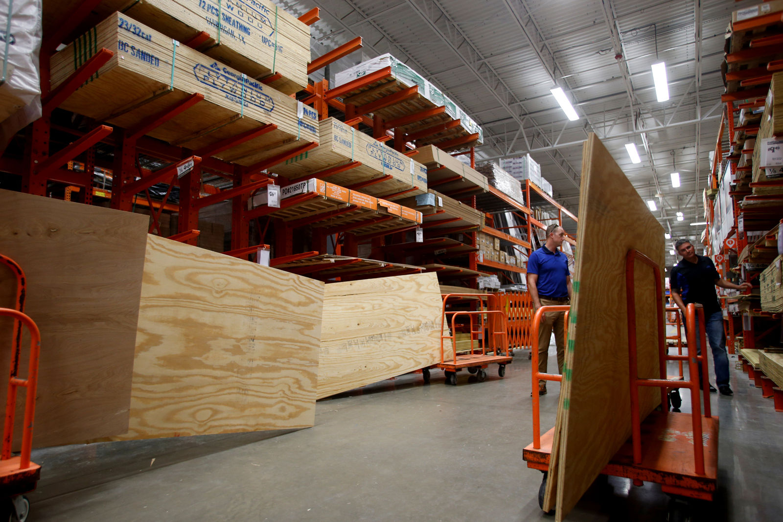 TAMPA, FL - SEPTEMBER 05:  Shoppers gather plywood for makeshift storm shutters at a Home Depot store as residents in the area prepare ahead of Hurricane Irma on September 5, 2017 in Tampa, Florida. The National Hurricane Center (NHC) has reported that  Hurricane Irma has strengthened to a Category 5 storm as it crosses into the Caribbean and is expected to move on towards Florida.  (Photo by Brian Blanco/Getty Images)