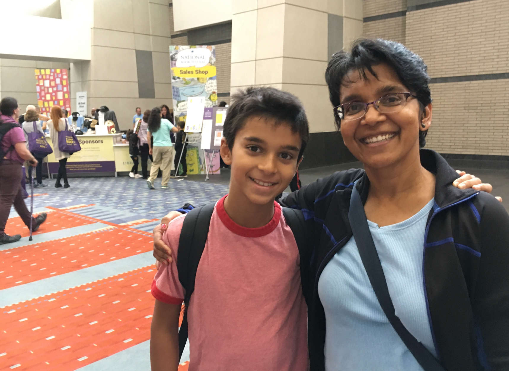 Joanne D'Souza and 12-year-old Elias Bernstein at the National Book Festival. (WTOP/Kate Ryan) 