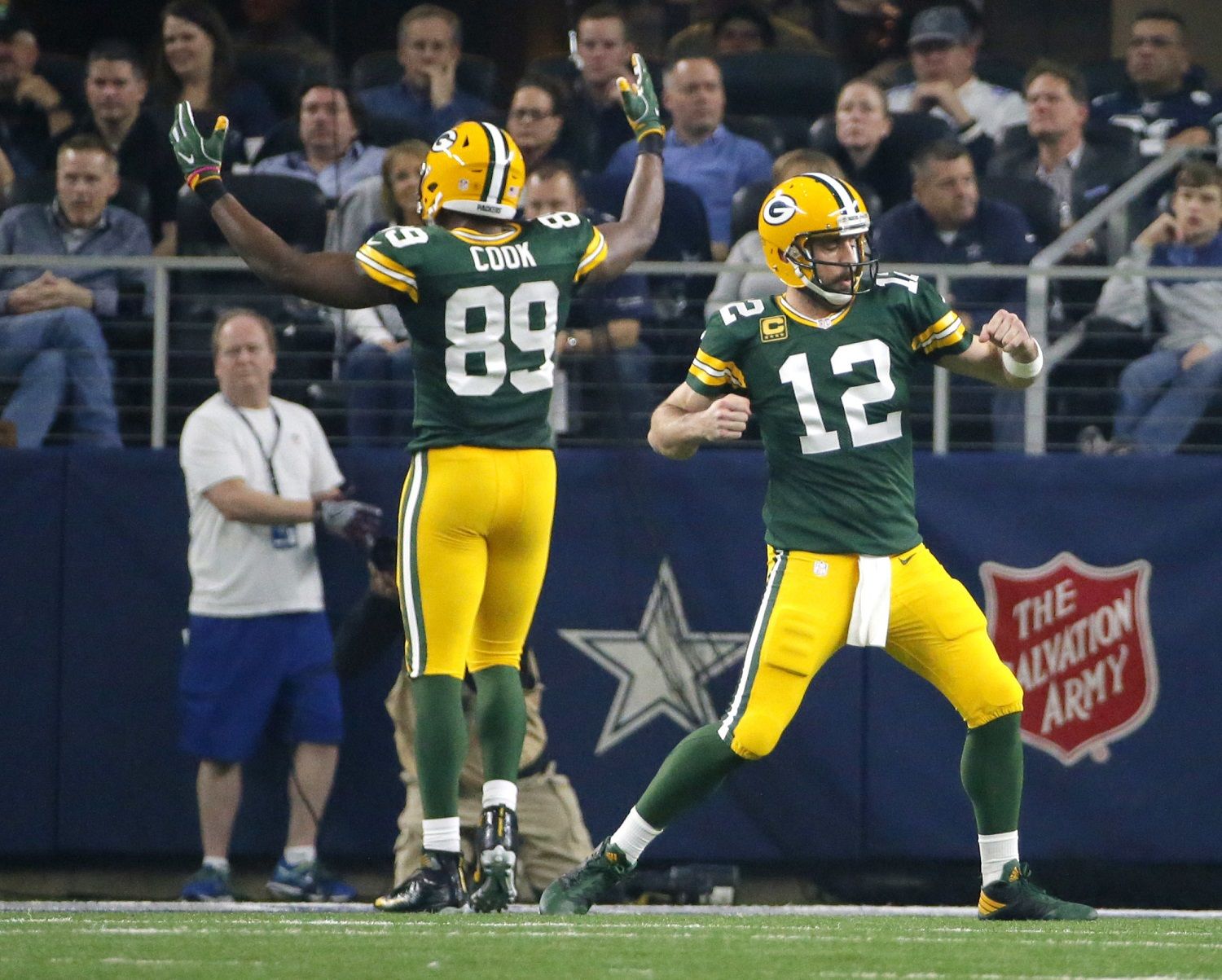 Green Bay Packers quarterback Aaron Rodgers (12) and Jared Cook (89) celebrate after a touchdown during the first half of an NFL divisional playoff football game against the Dallas Cowboys Sunday, Jan. 15, 2017, in Arlington, Texas. (AP Photo/Tony Gutierrez)