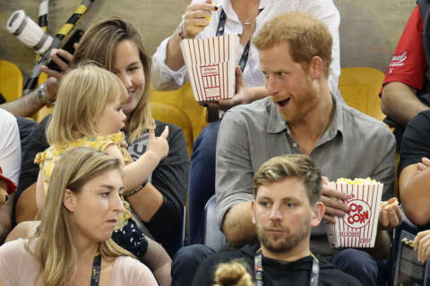 Stop, thief! Prince Harry catches toddler ‘stealing’ his popcorn