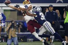 File-This Nov. 24, 2016, file photo shows Washington Redskins tight end Jordan Reed (86) laying out to catch a pass in front of Dallas Cowboys' Byron Jones (31) during the second half of an NFL football game in Arlington, Texas. Reed is back at Redskins practice after missing the first three-plus weeks of camp with a toe injury. With the first-team offense looking stagnant so far in the preseason, the big tight end's return is expected to make a major difference. (AP Photo/Michael Ainsworth, File)