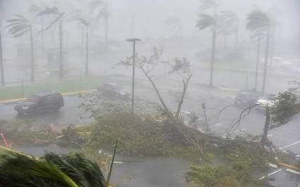 Wind from Hurricane Maria howled through the streets near San Juan in the early morning of Wednesday, Sept. 20, 2017.