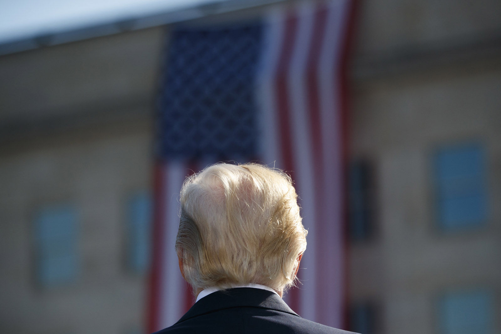 President Donald Trump stands for the national anthem during a ceremony to mark the anniversary of the Sept. 11 terrorist attacks, Monday, Sept. 11, 2017, at the Pentagon. (AP Photo/Evan Vucci)