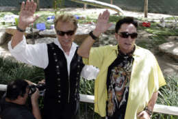 Siegfried Fischbacher, left, and Roy Horn pose for photos as they celebrate their tiger cubs' first birthday at Secret Garden &amp; Dolphin Habitat at the Mirage hotel and casino in Las Vegas, Tuesday, May 12, 2009.  (AP Photo/Jae C. Hong)