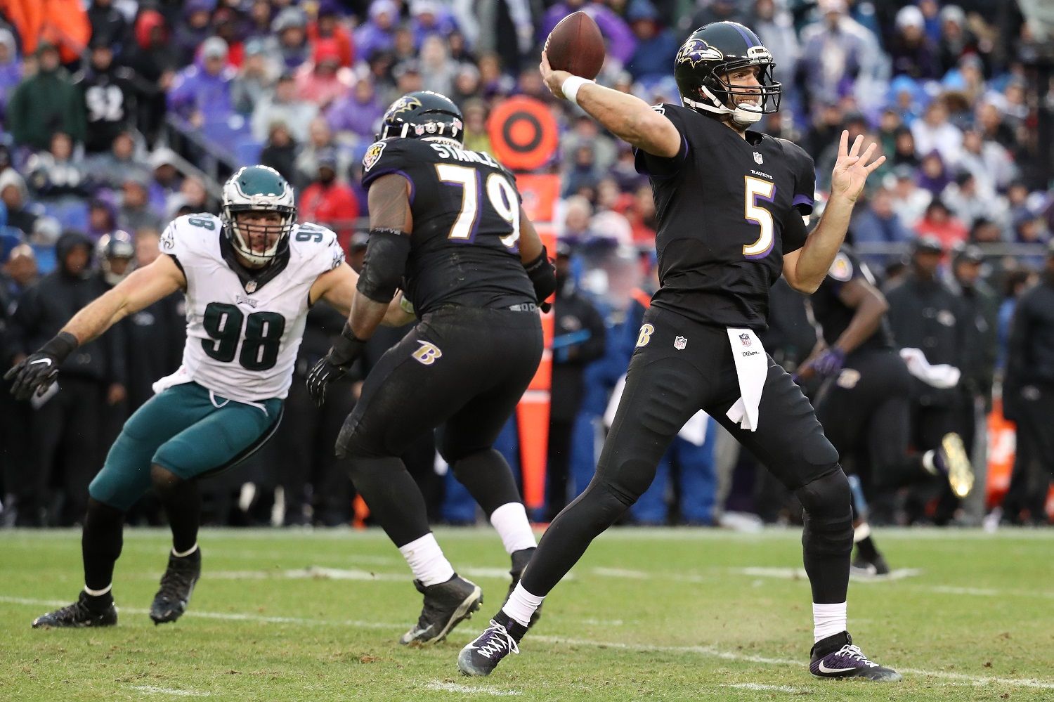 BALTIMORE, MD - DECEMBER 18: Quarterback Joe Flacco #5 of the Baltimore Ravens passes the ball while teammate offensive tackle Ronnie Stanley #79 blocks against defensive end Connor Barwin #98 of the Philadelphia Eagles in the second quarter at M&amp;T Bank Stadium on December 18, 2016 in Baltimore, Maryland. (Photo by Rob Carr/Getty Images)