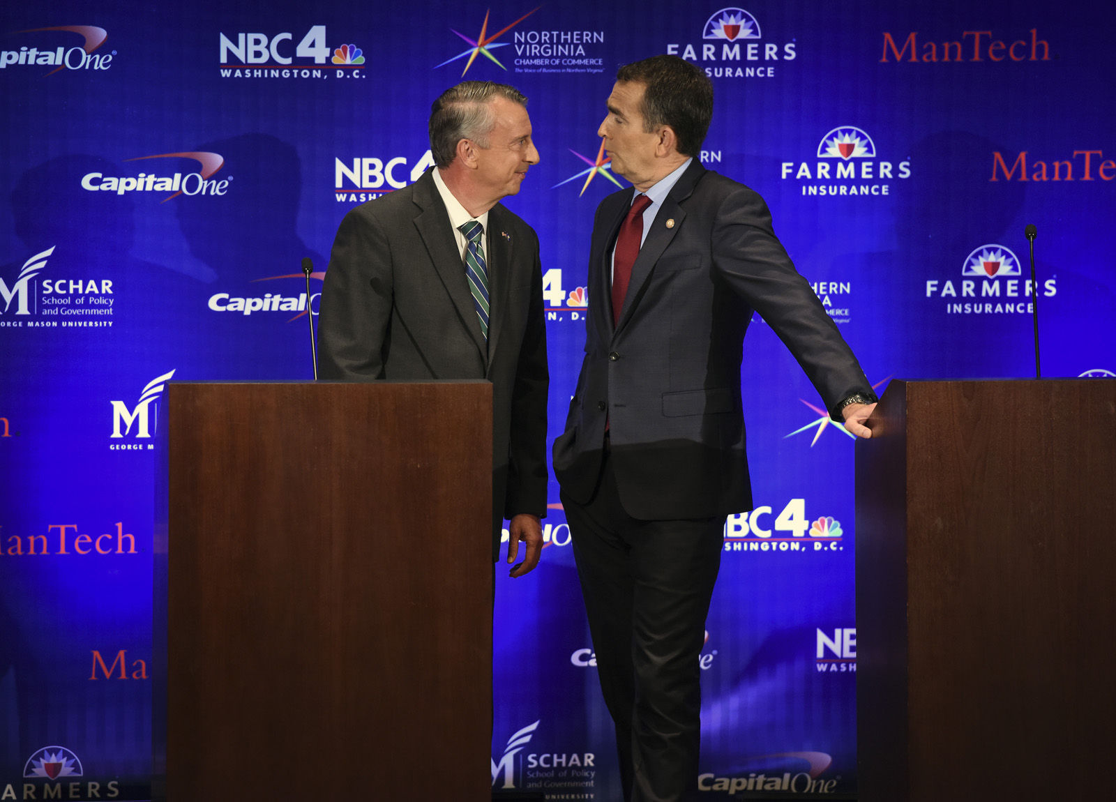 MCLEAN, VA - SEPTEMBER 19:
Republican candidate Ed Gillespie, left, and Lt. Gov. Ralph Northam, Democrat, greet each other before the start of the Gubernatorial debate on September, 19, 2017 in McLean, VA.
(Pool Photo by Bill O'Leary/The Washington Post)