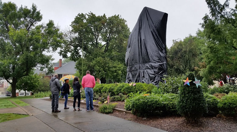 The statue has been covered in a black shroud by Charlottesville workers after the violence. 
(WTOP/Kathy Stewart) 