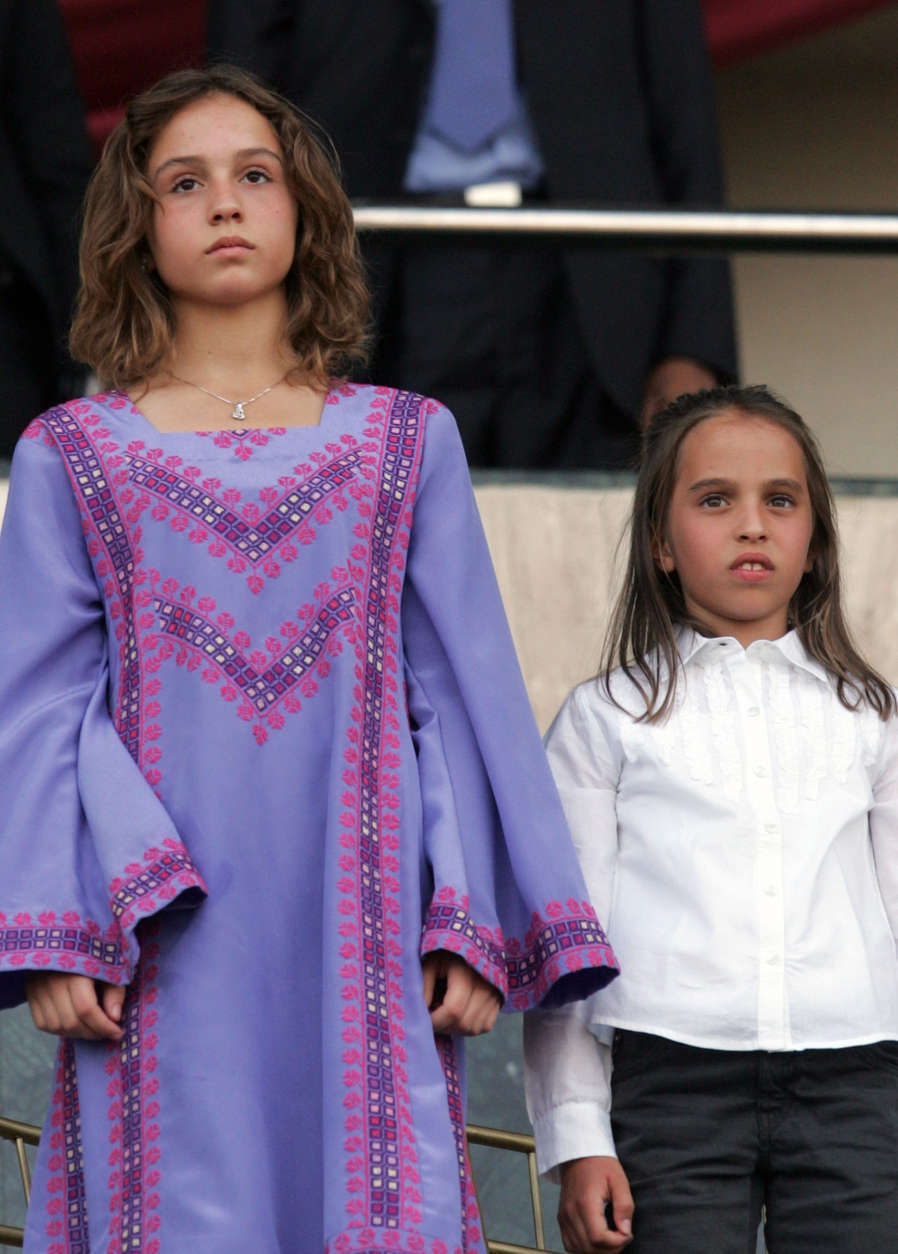 Daughters of Jordan's King Abdullah, Princess Eman, left, and Princess Salma attend a celebration of the 10th anniversary of the King's accession to the Throne at Amman International Stadium on Tuesday June 9, 2009. Hundreds of thousands of people lined the streets to greet King Abdullah and Queen Rania as their motorcade passed through the capital's streets to the site of the ceremony. (AP Photo/Mohammad Abu Ghosh)