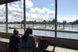 From the eating area set aside for customers of Captain White's, you can see the marina slips available for recreational boaters near the Maine Avenue Fish Market in this Sept. 7, 2017 photo. Improvements to the market are expected to wrap up sometime next spring. (WTOP/Michelle Basch)
