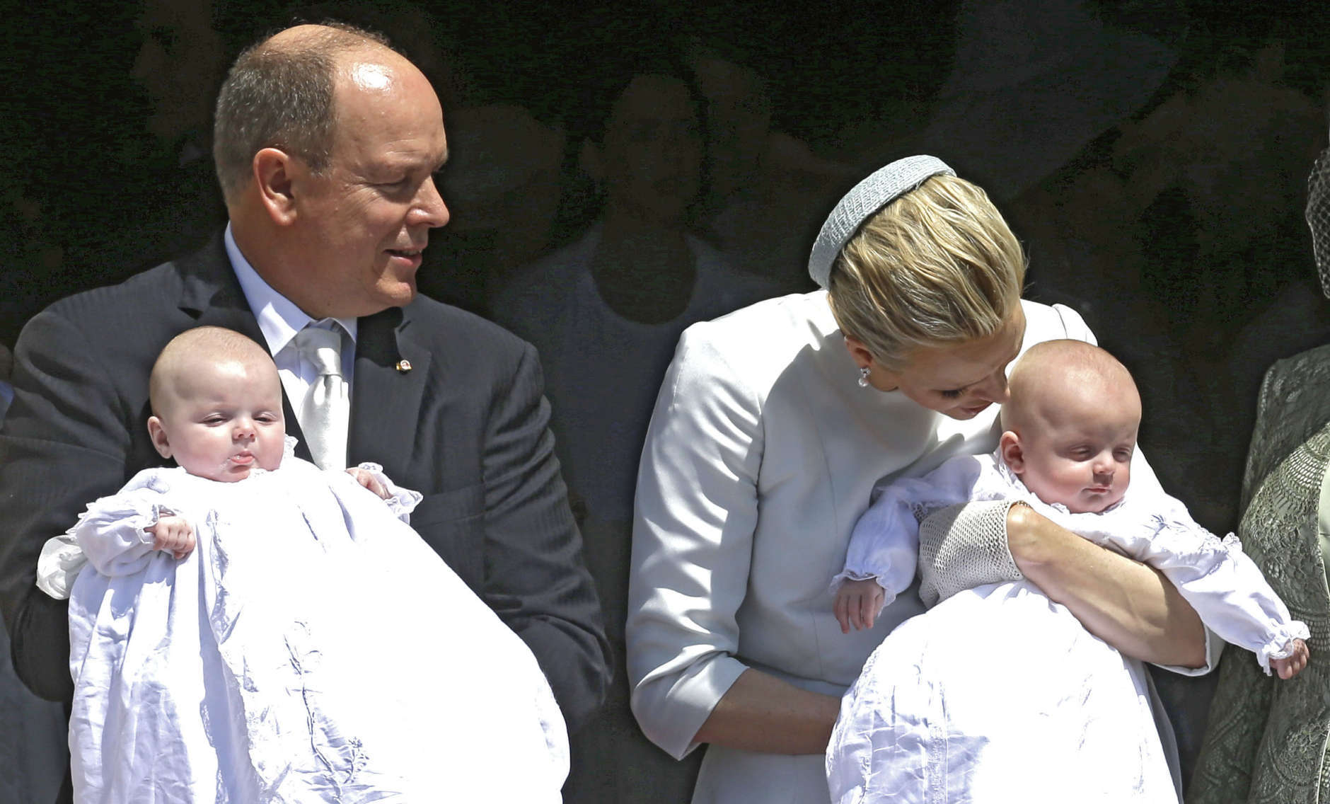 Prince Albert II of Monaco and his wife Princess Charlene pose with their twins babies Princess Gabriella, left, and Prince Jacques, right, after their baptism ceremony in the Cathedral of Monaco, Sunday, May 10, 2015, in Monaco. Monaco's newest royals Prince Jacques Honore Rainier and Princess Gabriella Therese Marie were christened at a ceremony in Monaco on Sunday. Crowds turned out in their thousands to catch a glimpse of the twins and their parents Prince Albert II and Princess Charlene. (AP Photo/Lionel Cironneau)
