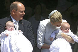 Prince Albert II of Monaco and his wife Princess Charlene pose with their twins babies Princess Gabriella, left, and Prince Jacques, right, after their baptism ceremony in the Cathedral of Monaco, Sunday, May 10, 2015, in Monaco. Monaco's newest royals Prince Jacques Honore Rainier and Princess Gabriella Therese Marie were christened at a ceremony in Monaco on Sunday. Crowds turned out in their thousands to catch a glimpse of the twins and their parents Prince Albert II and Princess Charlene. (AP Photo/Lionel Cironneau)