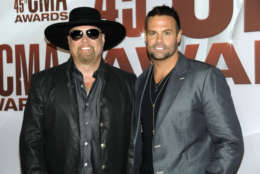 Eddie Montgomery, left, and Troy Gentry of Montgomery Gentry arrive at the 45th Annual CMA Awards in Nashville on Wednesday, Nov. 9, 2011. (AP Photo/Evan Agostini)