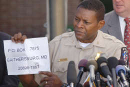 Montgomery County police chief Charles Moose holds a paper with a corrected address for the public to send tips  on the sniper shootings in the Washington D.C. area, during a news briefing at Montgomery County police headquarters in Rockville, Md., Monday, Oct. 14, 2002. (AP Photo/Don Wright)