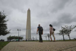 Visitors walks toward the Washington Monument on the National Mall in Washington, Monday, Sept. 26, 2016. The National Park Service announced it wants to prohibit sports and recreation on multiple fields along the National Mall, but D.C. residents and government officials do not agree with the decision. (AP Photo/Pablo Martinez Monsivais)
