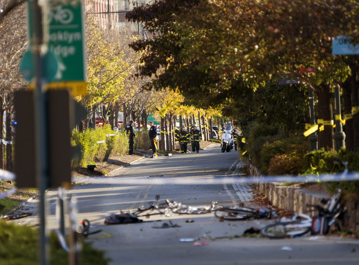 Bicycles and debris lies on a bike path after a motorist drove onto the path near the World Trade Center memorial, striking and killing several people Tuesday, Oct. 31, 2017.  (AP Photo/Craig Ruttle)