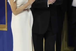 President Donald J. Trump yells with the crowd as he waits with first lady Melania Trump before cutting a cake at The Salute To Our Armed Services Inaugural Ball Friday, Jan. 20, 2017, in Washington. (AP Photo/David J. Phillip)