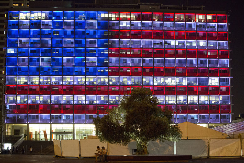 Tel Aviv's municipality building is lit with the colors of the American flag in solidarity with victims of Las Vegas shooting in Tel Aviv, Israel, Monday, Oct. 2, 2017. (AP Photo/Ariel Schalit)