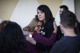 Maritza Rodriguez, right, embraces Emily Zamora after a special service at Guardian Angel Cathedral for the mass shooting on the Las Vegas Strip, Monday, Oct. 2, 2017, in Las Vegas. (AP Photo/John Locher)