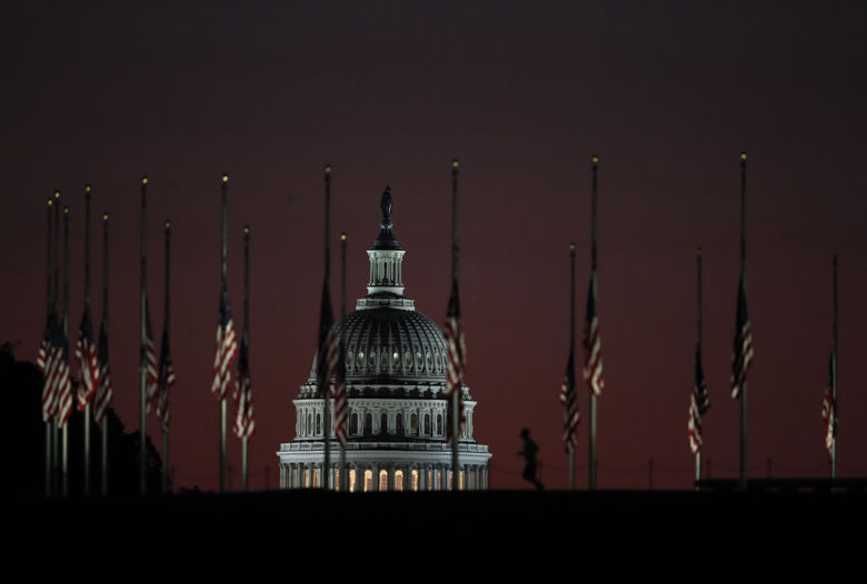 The U.S. Capitol dome backdrops a column of American flags standing at half-staff at dawn on Tuesday, Oct. 3, 2017, at the foot of the Washington Monument on the National Mall in Washington. President Donald Trump ordered flags to be flown at half-staff at the White House and upon all public buildings and grounds, at all military posts and naval stations, and on all naval vessels of the Federal Government in the District of Columbia and throughout the United States and its Territories and possessions until sunset on October 6, 2017, to pay respect for the victims of the shooting at a country music concert Sunday night in Las Vegas, the deadliest in modern U.S. history. (AP Photo/Manuel Balce Ceneta)