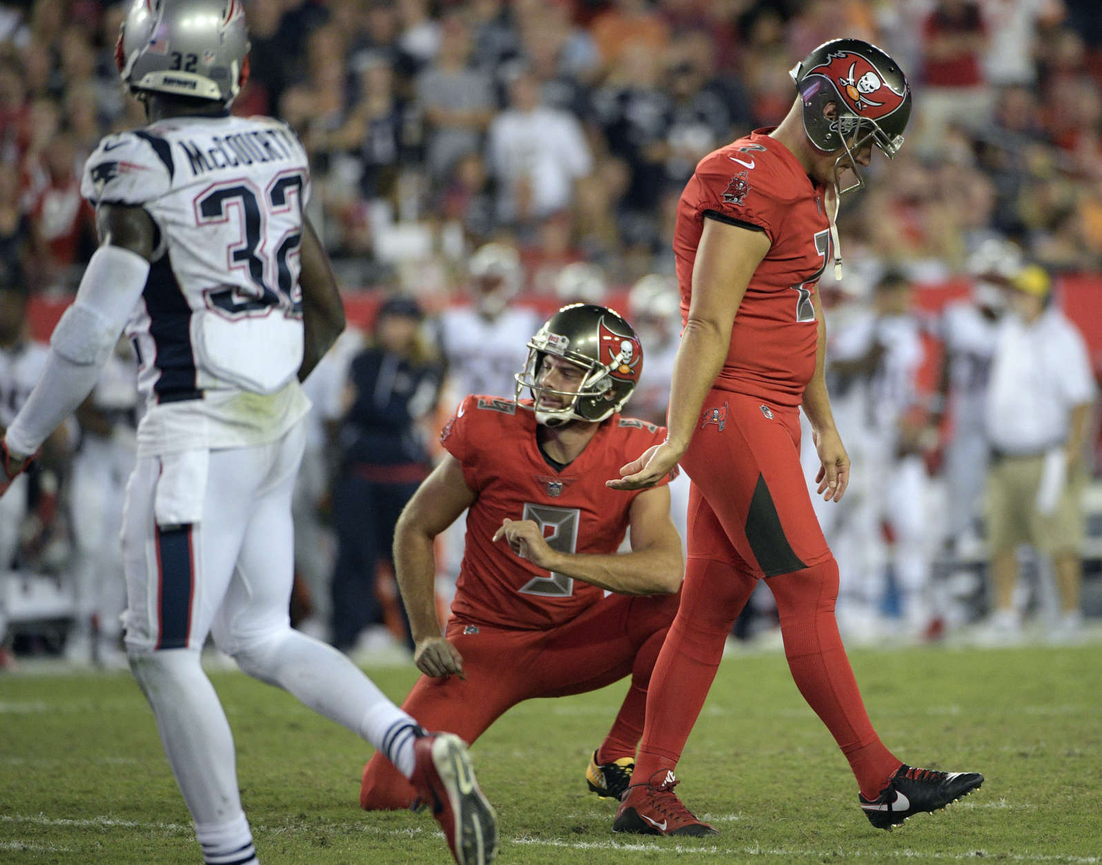 Tampa Bay Buccaneers kicker Nick Folk (2) reacts after missing a field goal against the New England Patriots during the fourth quarter of an NFL football game against the New England Patriots Thursday, Oct. 5, 2017, in Tampa, Fla. Holding for the Buccaneers is Bryan Anger. (AP Photo/Phelan Ebenhack)