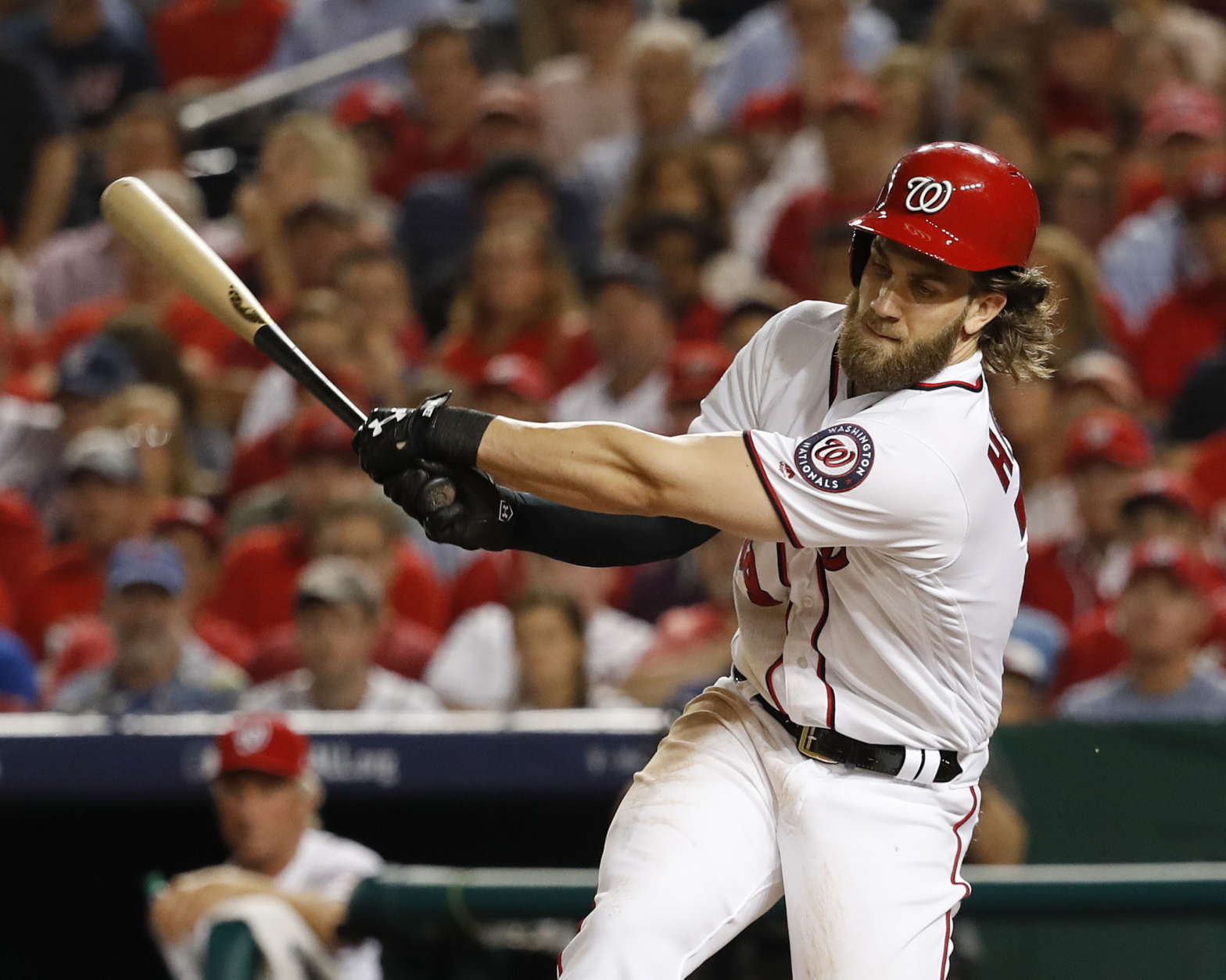 Washington Nationals Byrce Harper strikes out in the third inning against the Chicago Cubs in Game 1 of baseball's National League Division Series, at Nationals Park, Friday, Oct. 6, 2017, in Washington. (AP Photo/Pablo Martinez Monsivais)