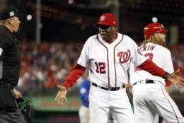 Washington Nationals manager Dusty Baker (12) argues a call of an out on Ryan Zimmerman with home plate umpire Cory Blaser, left, during Game 1 of baseball's National League Division Series against the Chicago Cubs, at Nationals Park, Friday, Oct. 6, 2017, in Washington. The Cubs won 3-0. (AP Photo/Alex Brandon)