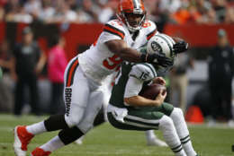 Cleveland Browns defensive end Myles Garrett, left, sacks New York Jets quarterback Josh McCown during the first half of an NFL football game, Sunday, Oct. 8, 2017, in Cleveland. (AP Photo/Ron Schwane)