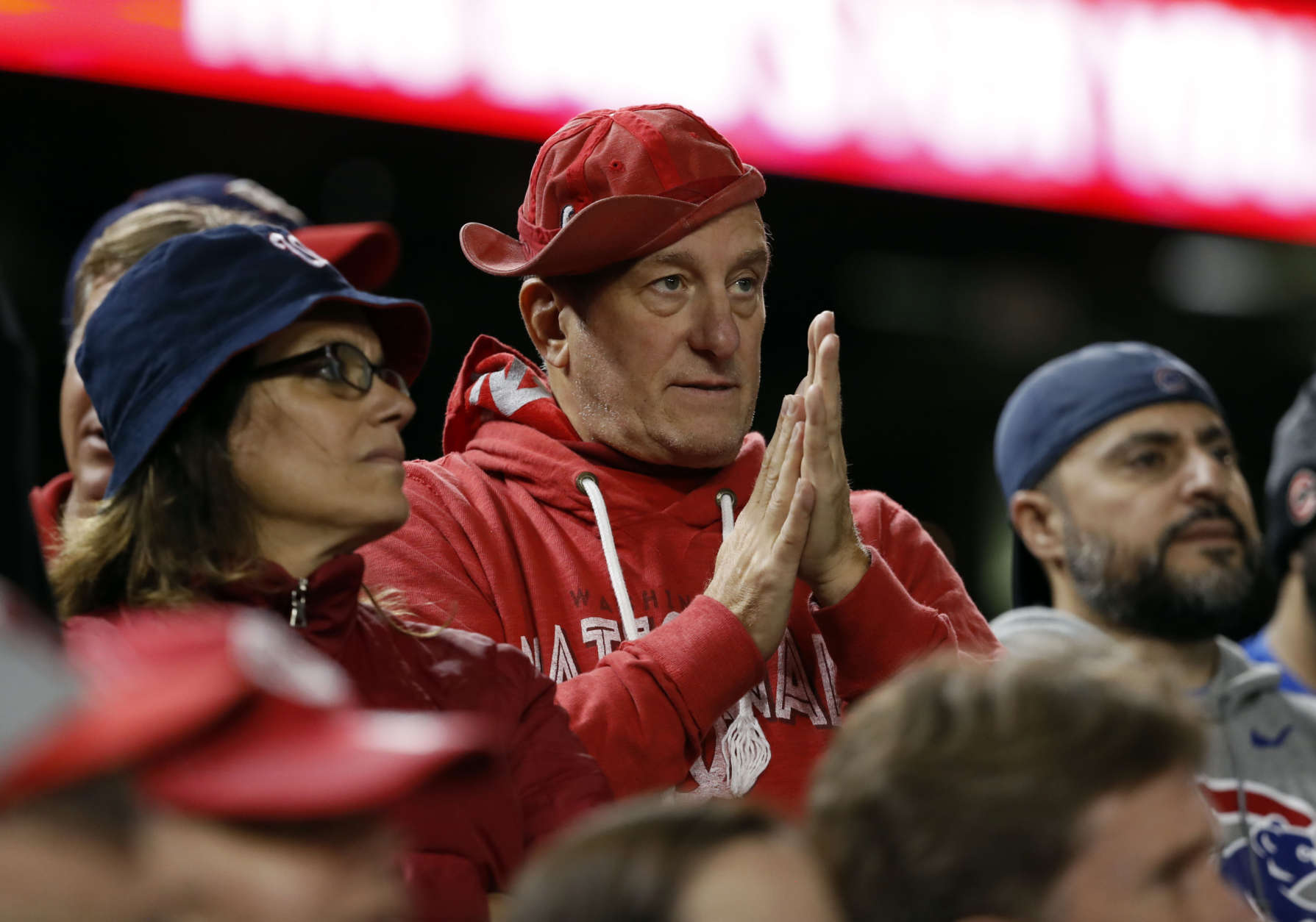 Washington Nationals fans watch the action during Game 5 of baseball's National League Division Series against the Chicago Cubs, at Nationals Park, Thursday, Oct. 12, 2017 in Washington. The Cubs won 9-8 and won the series. (AP Photo/Pablo Martinez Monsivais)