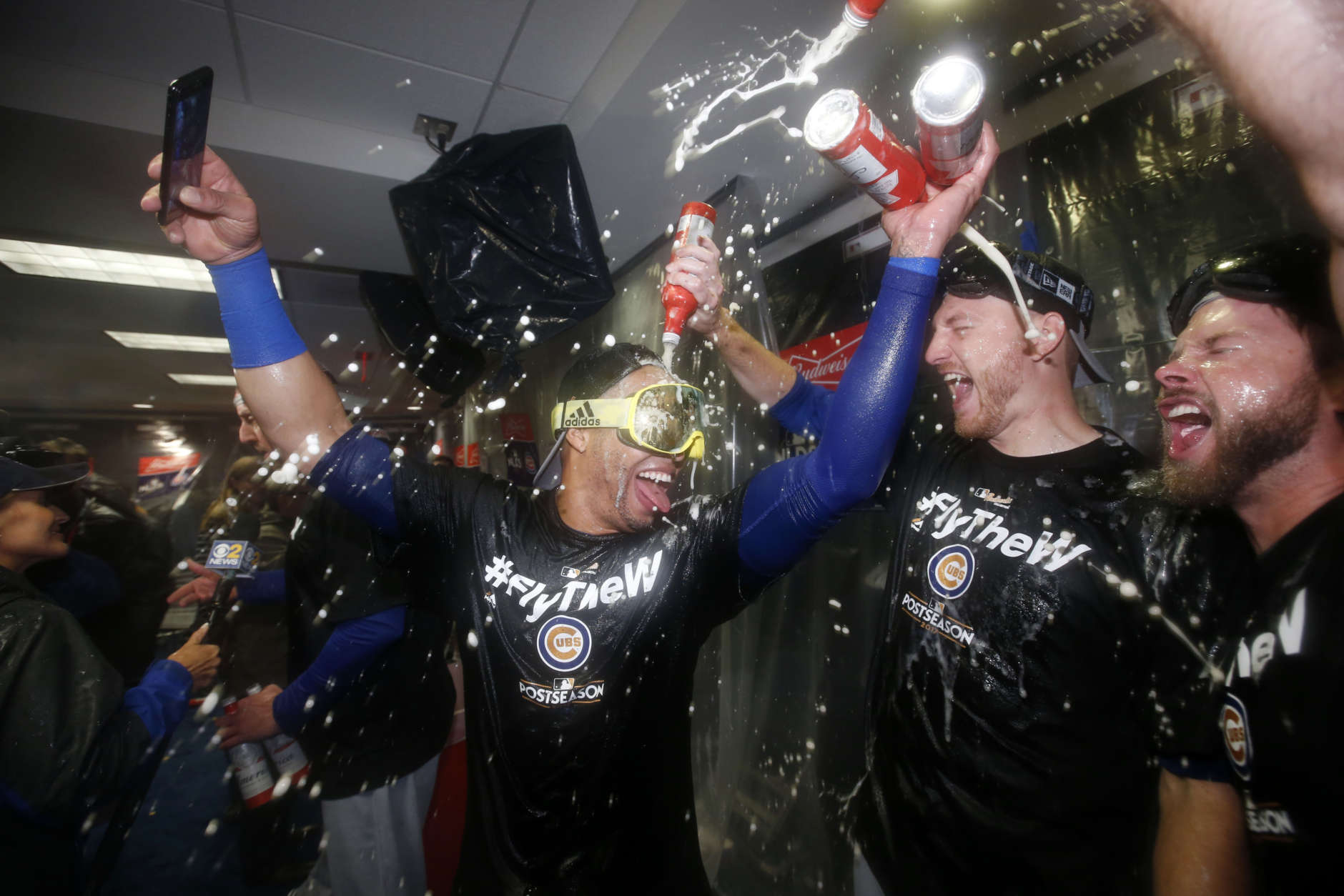 Members of the Chicago Cubs celebrate after Game 5 of baseball's National League Division Series against the Washington Nationals, at Nationals Park, early Friday, Oct. 13, 2017, in Washington. The Cubs won 9-8. (AP Photo/Alex Brandon)