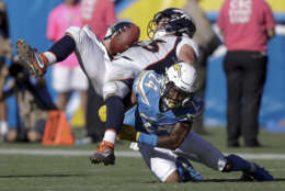 Denver Broncos tight end A.J. Derby, top, is tackled by Los Angeles Chargers cornerback Trevor Williams during the second half of an NFL football game Sunday, Oct. 22, 2017, in Carson, Calif. (AP Photo/Jae C. Hong)