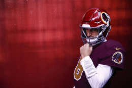 Washington Redskins quarterback Kirk Cousins (8) waits in the tunnel before an NFL football game against the Dallas Cowboys in Landover, Md., Sunday, Oct. 29, 2017. (AP Photo/Patrick Semansky)