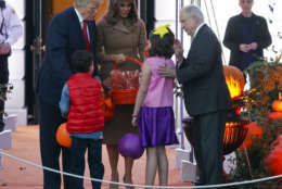 President Donald Trump and first lady Melania Trump meet Attorney General Jeff Sessions' grandchildren as Trump welcomes children from the Washington area and children of military families to trick-or-treat celebrating Halloween at the South Lawn of the White House in Washington, Monday, Oct. 30, 2017. (AP Photo/Pablo Martinez Monsivais)