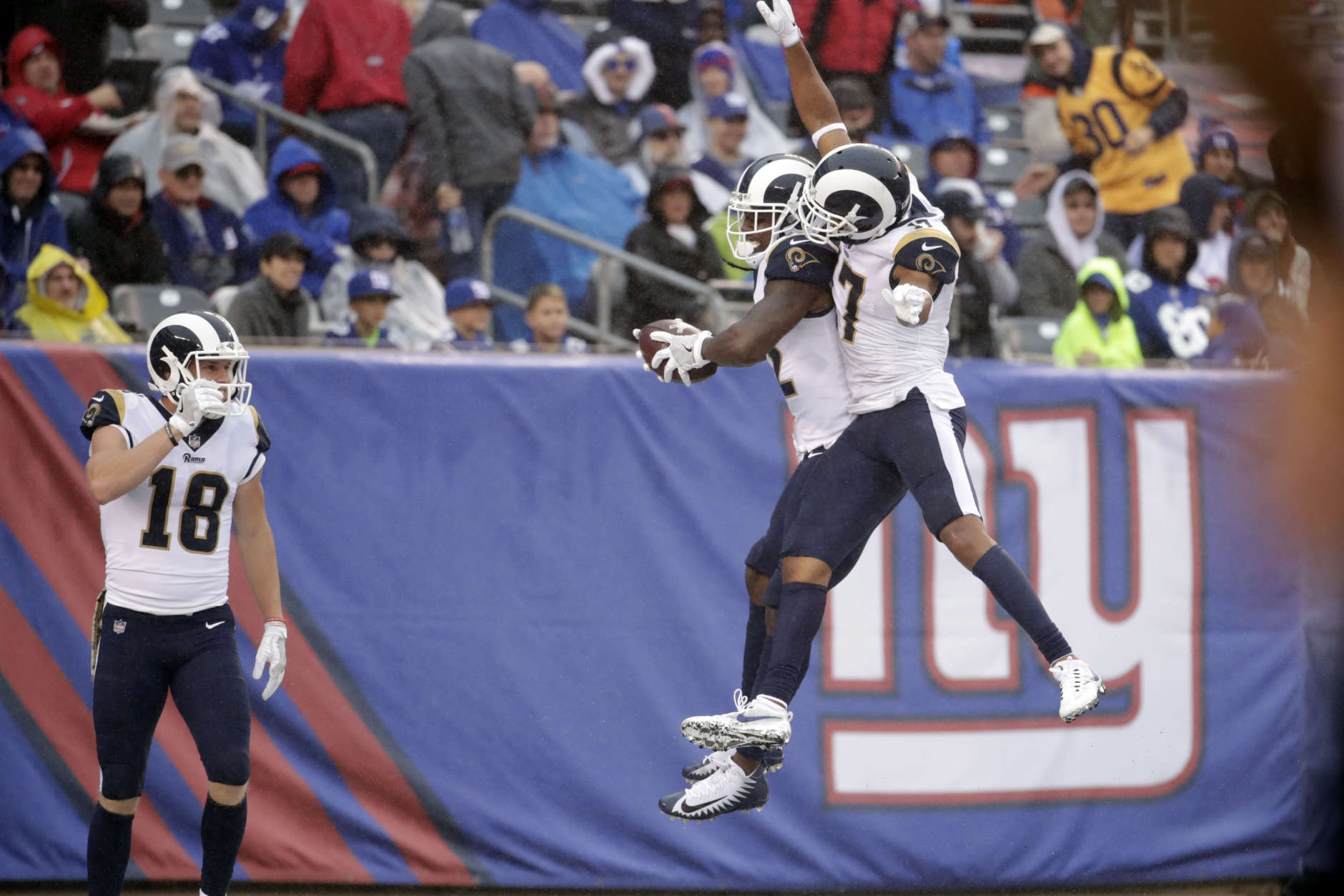 Los Angeles Rams' Sammy Watkins (12) celebrates with teammate Robert Woods (17) as Cooper Kupp (18) watches during the first half of an NFL football game against the New York Giants Sunday, Nov. 5, 2017, in East Rutherford, N.J. (AP Photo/Julio Cortez)