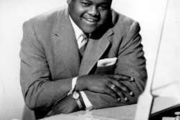 This is a 1956 photograph of singer, composer and pianist Fats Domino. He popularized rock and roll in the 1950s and early 1960s with his songs that include "Blueberry Hill," "Ain't That a Shame," and "Blue Monday."  (AP Photo)