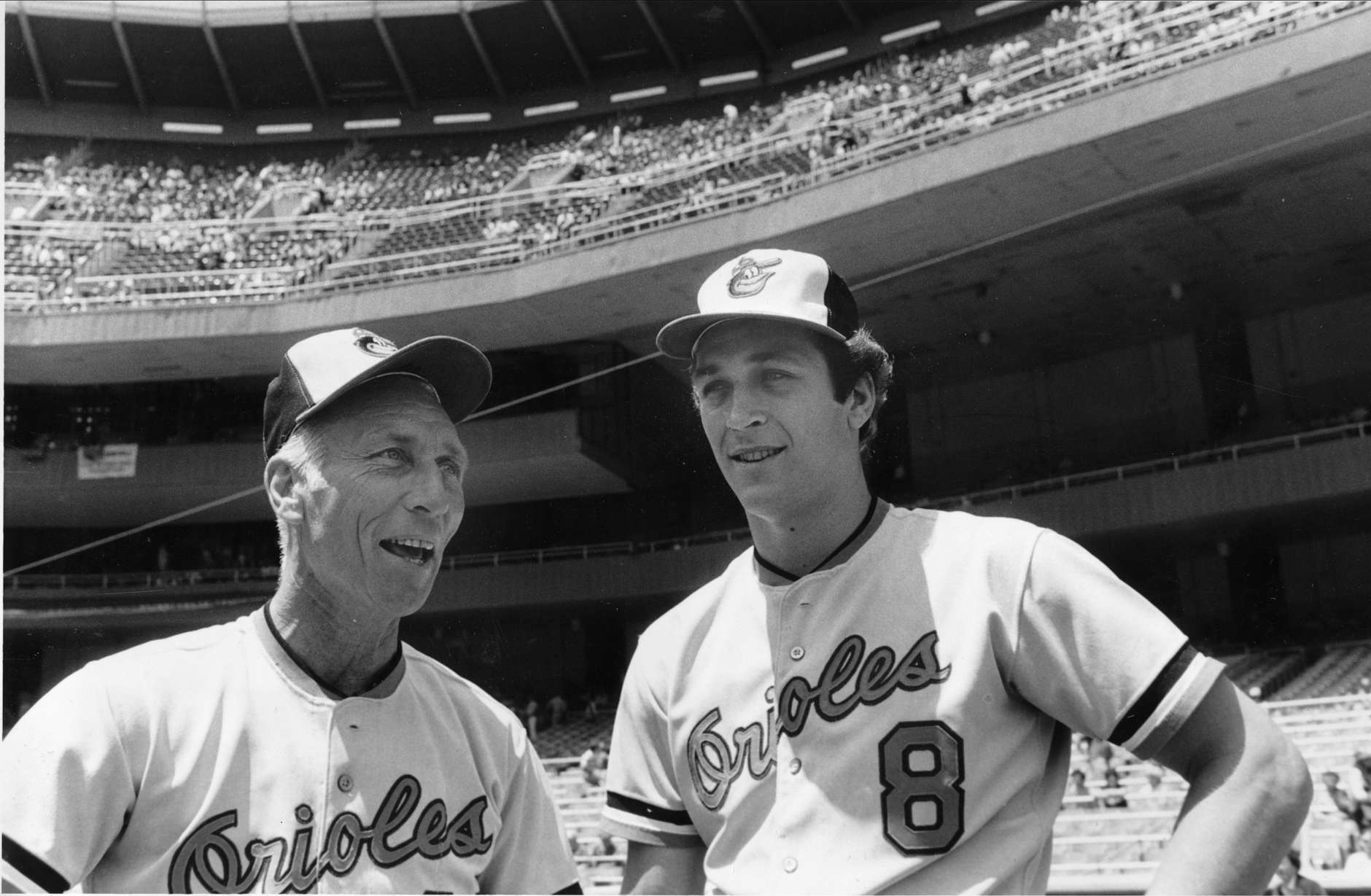 Baltimore Orioles pitching coach Cal Ripken Sr., left, gets a father's day greeting from his son Cal Jr. at Yankee Stadium in the Bronx, N.Y., Sunday, June 20, 1982.  Cal Jr. is an infielder with the Orioles.  (AP Photo/Harry Harris)