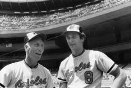 Baltimore Orioles pitching coach Cal Ripken Sr., left, gets a father's day greeting from his son Cal Jr. at Yankee Stadium in the Bronx, N.Y., Sunday, June 20, 1982.  Cal Jr. is an infielder with the Orioles.  (AP Photo/Harry Harris)