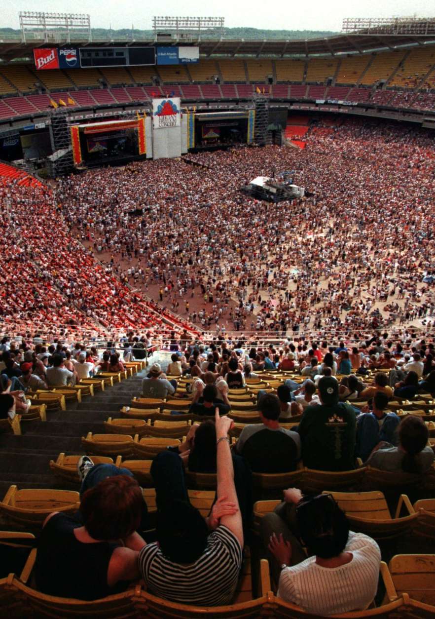 The floor of RFK Stadium is packed with concert goers attending the Tibetan Freedon Festival Sunday, June 14, 1998 in Washington.  Some fans, however, opted for the shade of traditional stadium seating. The concert featuring some of the world's top rock bands performed to advocate freedom for Tibet. (AP Photo/Ken Cedeno)