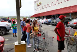Dozens are lined outside a supermarket in Canóvanas, Puerto Rico, about 20 miles southeast of San Juan.   (WTOP/Albert Shimabukuro)