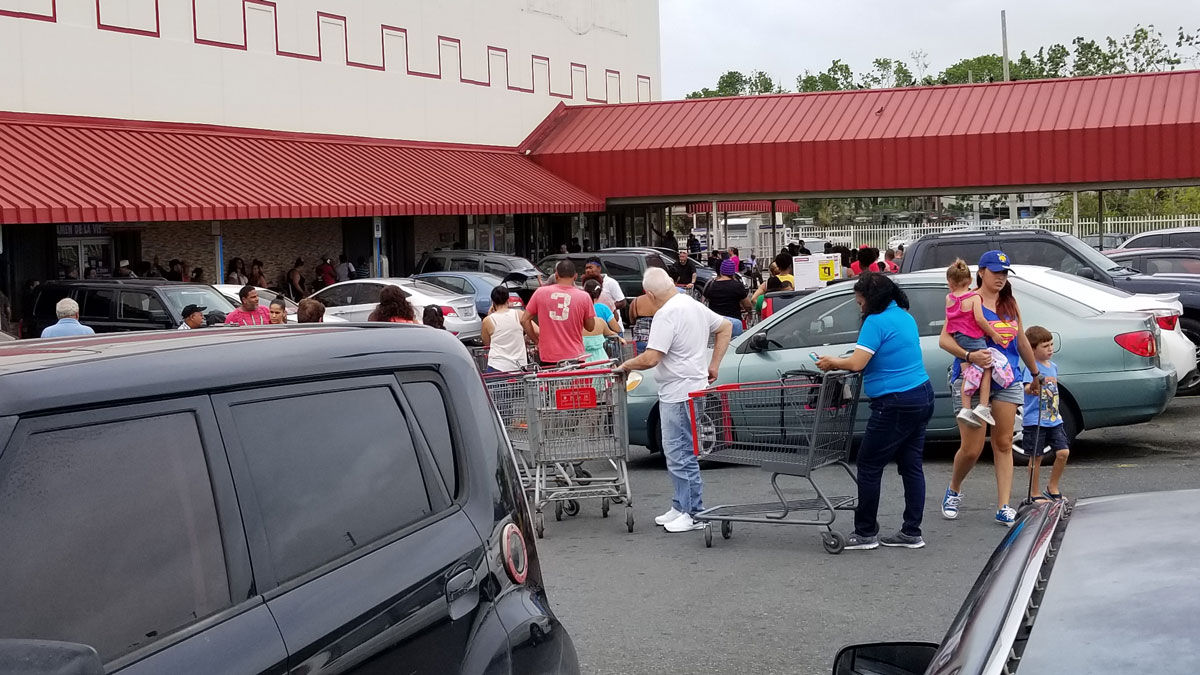 Dozens are lined outside a supermarket in Canóvanas, Puerto Rico, about 20 miles southeast of San Juan.   (WTOP/Albert Shimabukuro)