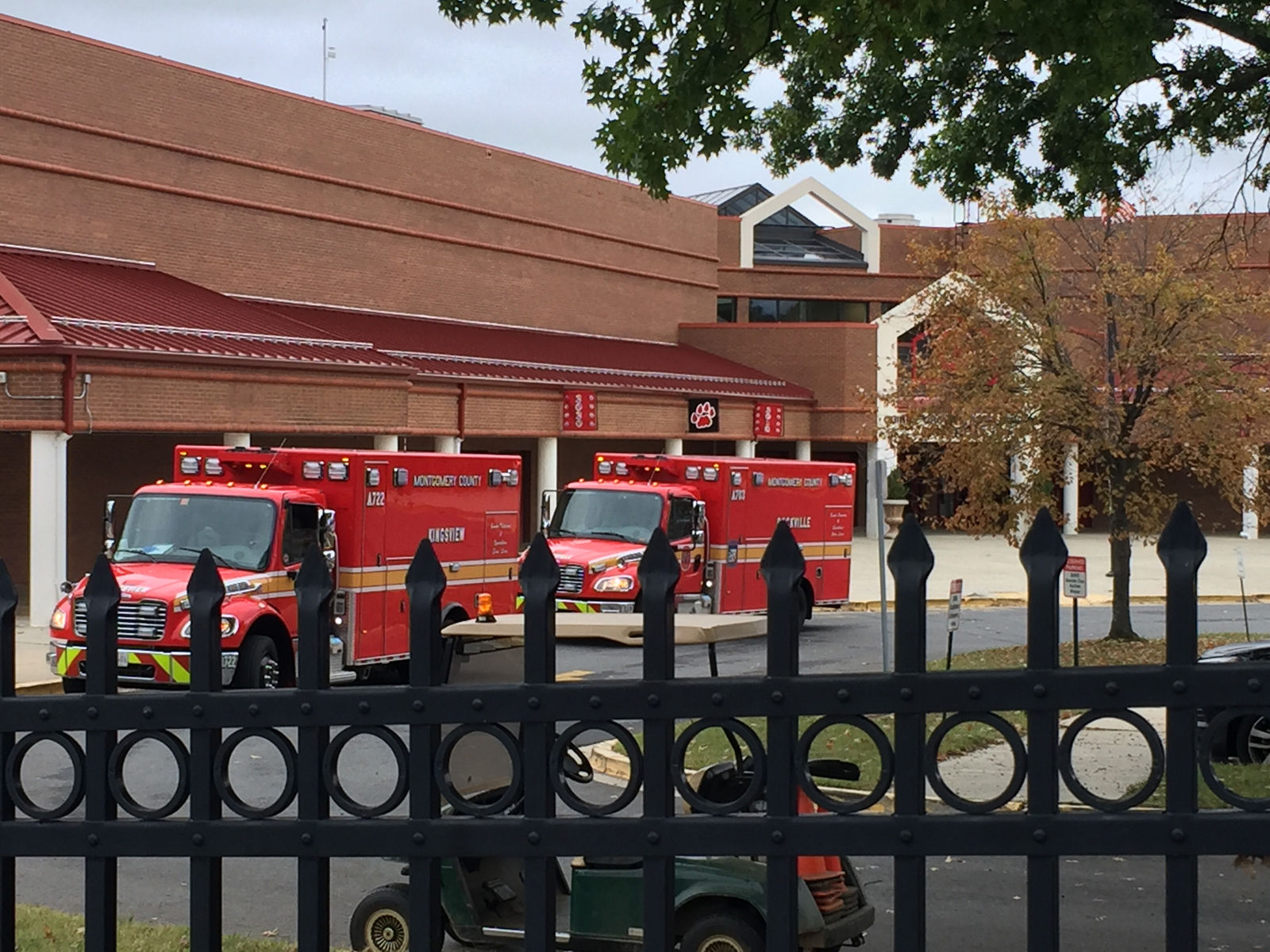First responders outside of Quince Orchard High School in Gaithersburg, Maryland, where 32 people were treated for bee stings. (WTOP/Dennis Foley)