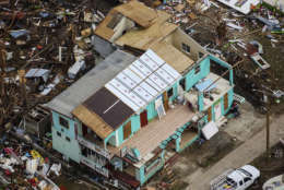 This photo provided by the Royal Navy and taken on Sunday, Sept. 24, 2017 shows the devastation left by Hurricane Irma in Jost Van Dyke, British Virgin Islands. Irma, once the most powerful hurricane ever recorded in the open Atlantic, wreaked havoc in parts of the Caribbean â€” Antigua and Barbuda, Anguilla and St. Martin, the U.S. and British Virgin Islands, Turks and Caicos, the Bahamas and parts of Cuba â€” leaving more than three dozen people dead and turning vacation island paradises into devastated landscapes. (Joel Rouse/Royal Navy via AP)