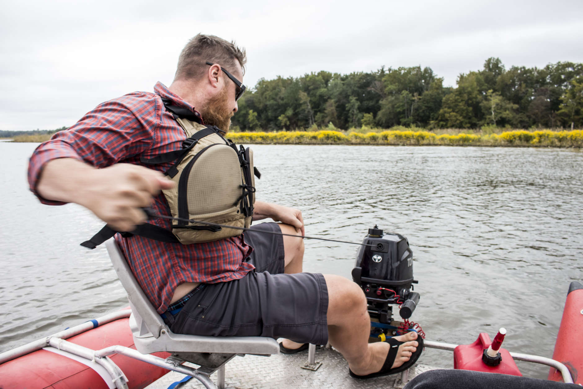 Terrain 360 founder Ryan Abrahamsen rips the pull cord to start the motor, Tuesday Sept. 26, 2017, in Upper Marlboro, Maryland. Abrahamsen is mapping the Patuxent River, in partnership with the Chesapeake Conservancy, to create virtual river tours. (Alex Mann/Capital News Service)