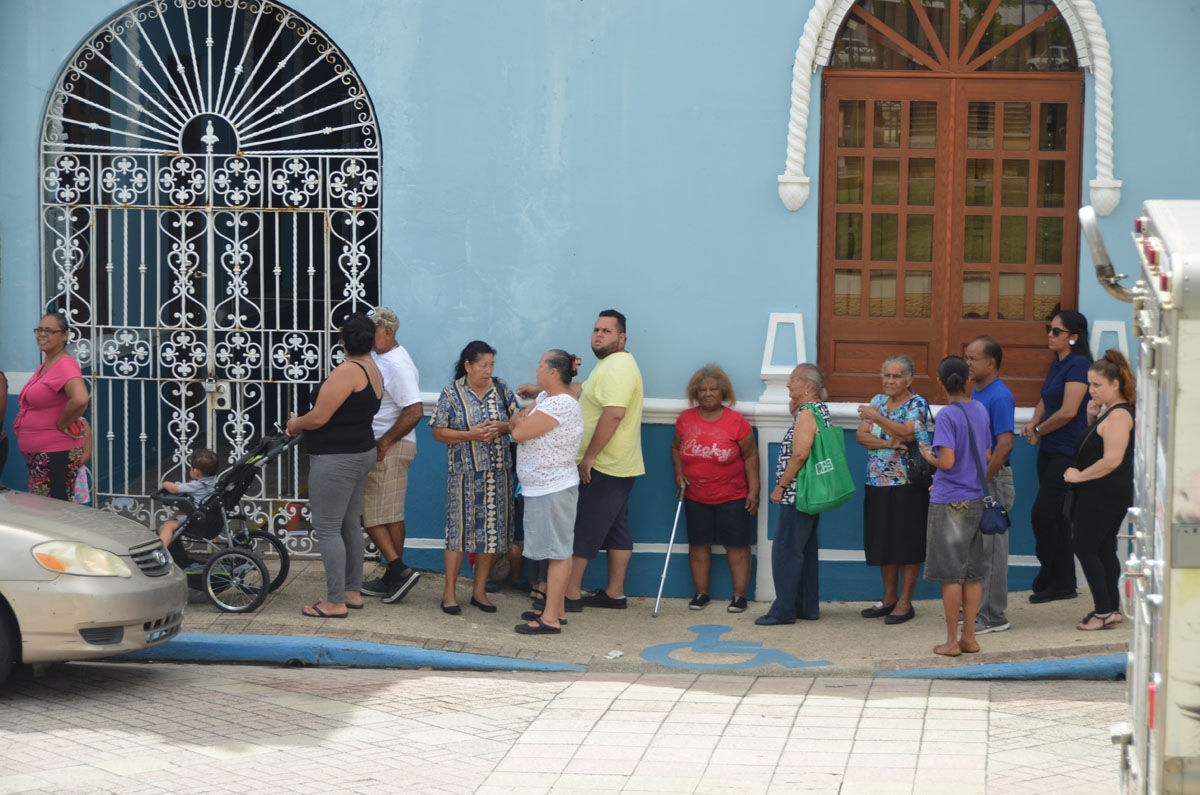 People are lined up outside of the city hall in Fajardo, in the eastern region of Puerto Rico. The city is some 40 miles from San Juan. (Photo courtesy of NAB's Suzanne Raven, @broadlyserving)