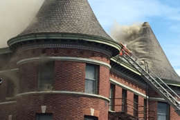An apartment building burns at Vermont Avenue and Q Street in Northwest D.C. (WTOP/Lisa Weiner)