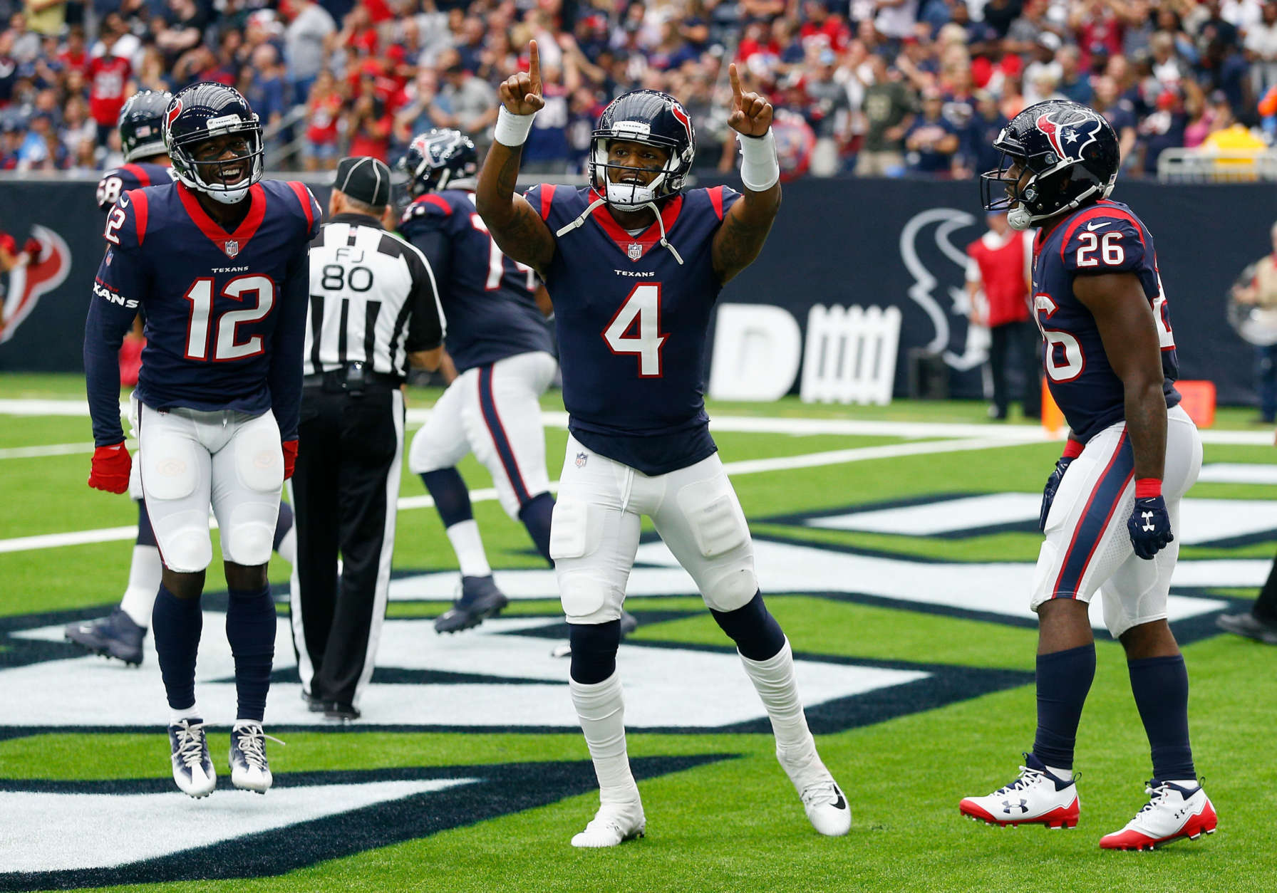 HOUSTON, TX - OCTOBER 01:  Deshaun Watson #4 of the Houston Texans celebrates with Bruce Ellington #12 and Lamar Miller #26 after scoring on a one yard run in the second quarter against the Tennessee Titans at NRG Stadium on October 1, 2017 in Houston, Texas.  (Photo by Bob Levey/Getty Images)