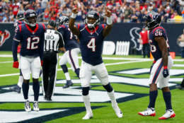HOUSTON, TX - OCTOBER 01:  Deshaun Watson #4 of the Houston Texans celebrates with Bruce Ellington #12 and Lamar Miller #26 after scoring on a one yard run in the second quarter against the Tennessee Titans at NRG Stadium on October 1, 2017 in Houston, Texas.  (Photo by Bob Levey/Getty Images)