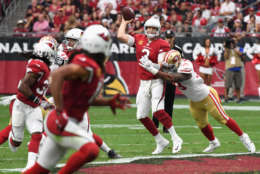 GLENDALE, AZ - OCTOBER 01: Defensive end Aaron Lynch #59 of the San Francisco 49ers hits quarterback Carson Palmer #3 of the Arizona Cardinals during the first half of the NFL game at the University of Phoenix Stadium on October 1, 2017 in Glendale, Arizona.  (Photo by Norm Hall/Getty Images)