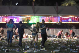 LAS VEGAS, NV - OCTOBER 01:  People run from the Route 91 Harvest country music festival after apparent gun fire was heard on October 1, 2017 in Las Vegas, Nevada. There are reports of an active shooter around the Mandalay Bay Resort and Casino.  (Photo by David Becker/Getty Images)