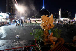 LAS VEGAS, NV - OCTOBER 01:  A person  takes cover at the Route 91 Harvest country music festival after apparent gun fire was heard on October 1, 2017 in Las Vegas, Nevada.  There are reports of an active shooter around the Mandalay Bay Resort and Casino.  (Photo by David Becker/Getty Images)